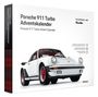 Text: Porsche 911 Turbo Adventskalender. Illustration: Ein weißer Porsche 911 mit roten Felgen auf der Verpackung.