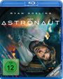 "Der Astronaut". "Eine der besten Kinoerfahrungen des 21. Jahrhunderts." Gesicht eines Mannes unter farbigen Lichtern.