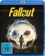 Text: "Fallout", "STAFFEL EINS", "FSK ab 16 freigegeben".  
Illustration: Person in blauer Kleidung verlässt Vault in verwüstete Landschaft.