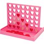 Ein pinkes Spielbrett mit Herzformen und roten Spielscheiben unten in einer Ablage.
