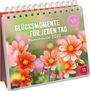 "GLÜCKSMOMENTE FÜR JEDEN TAG. Wochenkalender 2027." Spiralbindung, bunte Blumen im Hintergrund, lebendige Farben.