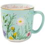 „Das Leben ist schön“ in rosa Schrift auf einer pastellblauen Tasse mit bunten Blumenillustrationen.