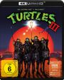 "Turtles III" und "FSK ab 6" sind zu sehen. Vier kämpferische Schildkröten auf schwarzen Pferden vor einem großen, roten Sonnenuntergang.
