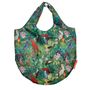 Bunte Tasche mit Papageien- und Blumenmuster. Lebendige Vögel auf grünem Hintergrund.