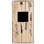 Holzstempel mit schwarzen Pflanzenmotiven in einem rechteckigen Set arrangiert.