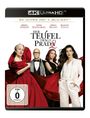 „Der Teufel trägt Prada 2“. Vier elegant gekleidete Personen, zwei in Rot und eine in Weiß.