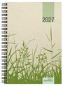 Text "2027", "gedruckt auf GRASPAPIER". Illustration von grünem Gras auf beigem Hintergrund. Spiralbindung links.
