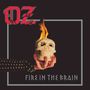 "FIRE IN THE BRAIN" steht unten. Oben "OZ". Eine Hand mit roten Nägeln hält einen brennenden Totenschädel.
