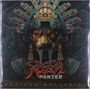 Rush Panzer, Mexican Mysteries. Ein stilisiertes Gesicht mit roten Augen und großen Zähnen, umgeben von aztekischen Motiven.