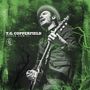 T.G. Copperfield, Super Raw 13. Ein Mann spielt Gitarre, trägt Hut; umgeben von grünen Strukturen.