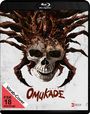Text: "OMUKADE", "FSK 18 beantragt", "Vorab-Cover". 

Das Cover zeigt einen Totenkopf kombiniert mit einem monströsen, spinnenartigen Wesen.
