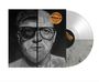 Aufklebertext: "Thomas D x Flo Mega, The Grey", darunter ein Porträt eines bärtigen Mannes mit Brille.