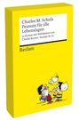 Text: "Charles M. Schulz Peanuts für alle Lebenslagen. 52 Karten mit Weisheiten von Charlie Brown, Snoopy & Co. Reclam."

Gelbe Schachtel mit Comicfiguren: Snoopy, Charlie Brown und andere heben Snoopy hoch.