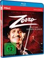 "George Hamilton ist Zorro mit der heißen Klinge." Ein Mann mit Schnurrbart, schwarzem Hut und Maske lächelt mit einer Rose.