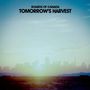 Text: "Boards of Canada, Tomorrow's Harvest". Verschwommene Skyline im Sonnenuntergang, gedämpfte Farben.