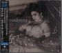 "Madonna Like a Virgin" steht auf der Verpackung. Eine Frau in Spitzenkleid ruht auf einem Bett, detailreich inszeniert.