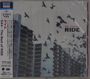 OX4 - The Best of RIDE. Viele Vögel vor einem Hochhaus. Japanischer Text links.