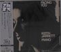 Aufschrift: "FACING YOU", "KEITH JARRETT", "PIANO". Links ist ein japanischer Textstreifen. Das Bild zeigt ein Gesicht im Schatten.