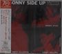 "SONNY SIDE UP" oben in Weiß, darunter rote Töne mit drei Musikern. Namen: Dizzy Gillespie, Sonny Stitt, Sonny Rollins. Japanische Schrift links.