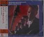 "new recordings never previously available, JOHN COLTRANE". Ein Saxophon, mehrere Porträts eines Mannes im Anzug.