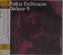 "John Coltrane Dakar" steht oben. Eine dunkle Silhouette eines Saxophonisten dominiert das Bild. Links sind japanische Schriftzeichen.