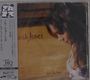 Auf einem Albumcover steht "Norah Jones feels like home". Links befindet sich ein vertikaler Streifen mit japanischen Texten.