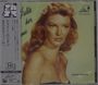 Texte: "Julie Is Her Name", "Julie London". Illustration einer Frau mit welligem Haar und ernstem Blick, im Vintage-Stil.
