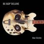 Text: "BE-BOP DELUXE" und "Axe Victim". Eine Gitarre in Form eines Totenkopfes auf schwarzem Hintergrund.