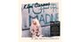 Kim Carnes, Uncovered Songs. The A&M, EMI America & MCA Years. Frau sitzt vor Zaun, trägt beigen Mantel.