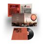 „Quiet Sun Mainstream“ steht auf dem Albumcover. Es zeigt eine Stadt mit einem großen orangen Kreis am Himmel.