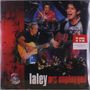 "laley MTv unplugged", darunter spielt eine Band. Gitarrist und Schlagzeuger sichtbar. Atmosphäre von Live-Auftritt.