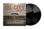 DR. FEELGOOD, OIL CITY CONFIDENTIAL. Zwei Schallplatten, grauer Hintergrund, Gebäude in der Mitte.