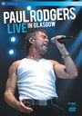 "PAUL RODGERS LIVE IN GLASGOW." Ein Mann singt leidenschaftlich, trägt ein weißes Tanktop, hält ein Mikrofon.