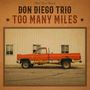 "Don Diego Trio Too Many Miles" in großer Schrift, daneben ein altes, rostiges rotes Pickup-Truck vor einer Wand.