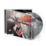 CD-Cover mit dem Text "KRIS BARRAS BAND - MONSTERS WE MADE". Illustration eines roten Monsters mit zerbrochenem Glas.