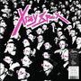 „X-Ray Spex“ in pink. Eine schwarz-weiße Menge trägt rosa Brillen, wodurch ein surrealer Effekt entsteht.