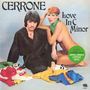 "CERRONE", "Love In C Minor". Mann in schwarzem Gewand, Frau mit grünem Tuch, Kleidung am Boden. 50th Anniversary Sticker.