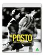 "IL POSTO" in gelber Schrift, darunter "A Film by Ermanno Olmi". Schwarz-weißes Bild von einer Frau und einem Mann im Laufen.