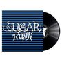 "Sugar Rush" in stilisierter Schrift, blaue und schwarze Streifen, Schallplatte halb sichtbar.