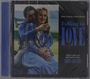 "Falling in Love" und Dave Grusin sind auf einem CD-Cover zu sehen. Ein Paar umarmt sich in entspannter Umgebung.
