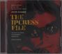Text: "New Recording of the 1965 Motion Picture Score John Barry The Ipcress File The City of Prague Philharmonic Orchestra Adam Klemens." Im Hintergrund ein stilisierter Gesichtsausschnitt mit Brille.