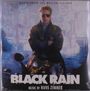 Text: "BLACK RAIN", "Music by Hans Zimmer". Eine Person in Lederjacke und Sonnenbrille steht vor einer beleuchteten Stadt.