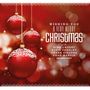 "Wishing you a very merry Christmas with Bing Crosby, Elvis Presley, Frank Sinatra, Dean Martin and many others."  
Rote Weihnachtskugeln.