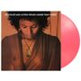 Text: "CHOCOLATE MILK/ACTION SPEAKS LOUDER THAN WORDS". Eine Frau schaut nach unten, sie trägt eine Kette. Pinke Vinyl.