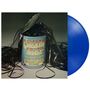 Text: "Chicken Shack In the Can" und Namen von Musikern. Eine geöffnete Dose mit herausquellenden Tonbändern. Blaue Vinyl-Schallplatte.