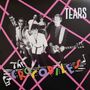 "TEARS" und "THE CROCODILES" in bunten Buchstaben. Eine Gruppe von sieben Personen mit Instrumenten, vor rosa Rautenmuster.