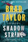 NEW YORK TIMES BESTSELLER, BRAD TAYLOR, SHADOW STRIKE. Roter Hubschrauber, Wald, See, Blockhütte.