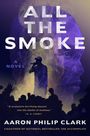 Text: "All the Smoke", "A Novel", "Aaron Philip Clark", "Coauthor of National Bestseller The Accomplice".  
Illustration: Rapper auf Bühne vor großem, stilisiertem Gesicht im Hintergrund.