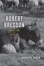 „Robert Bresson: Cinematic Style as Philosophy“ von Robert B. Pippin. Esel ruht auf Wiese, Schafe im Hintergrund.
