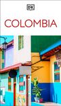 Text "COLOMBIA" in Rot und ein "DK"-Logo. Bunte Häuserfassaden mit kräftigen Farben und Pflanzen.